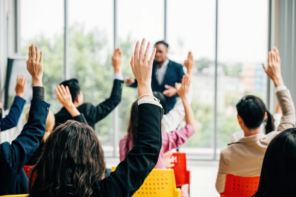 Business professionals come together for a corporate event featuring a conference and convention